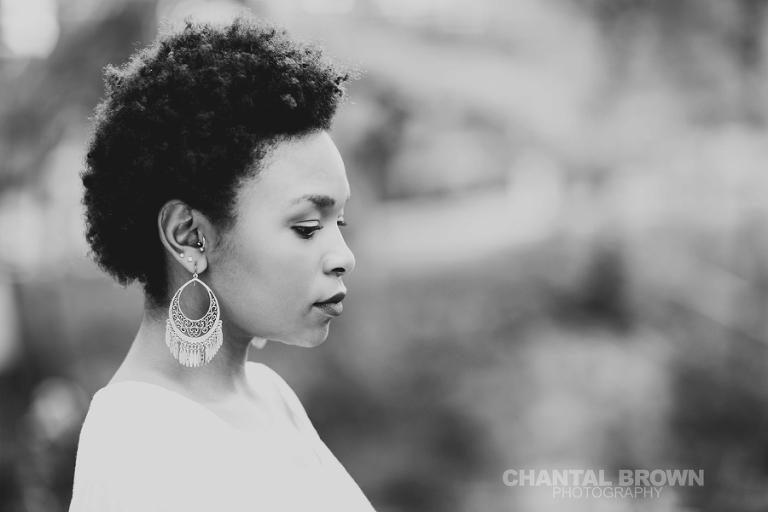 Dallas senior pictures taken at Highland Park Texas standing on a cloud of beautiful grass and surrounded with stunning tall trees.  This Dallas high school senior portraits is taken by Chantal Brown Photography.