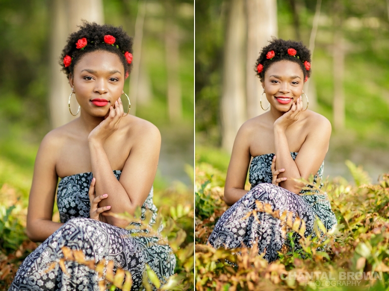 Highland Park Dallas senior portraits of a beautiful high school girl wearing a very pretty red roses head band setting on gorgeous green grass field smiling