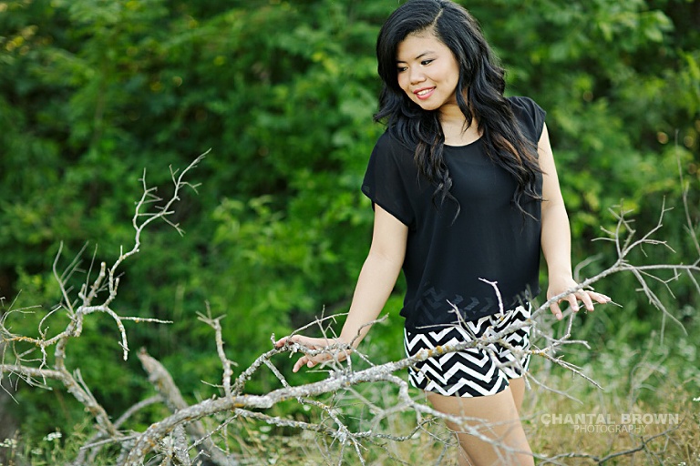 Carrollton Creekview senior portraits of a high school student taken outdoor in greenery grass field.