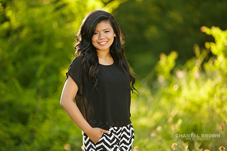 Carrollton Creekview high senior portraits of a high school student taken outdoor with beautiful sunlight as backlight.