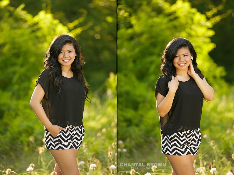 Carrollton senior portrait photographer of a beautiful high school girl taken out in the beautiful green field with pretty back light wearing chevron black and white shorts.