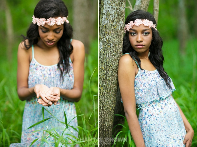 A Plano senior portrait picture of high school student holding a caterpillar in her palms out in the woods wearing a flower head band in baby blue dress taken by Chantal Brown Photography.