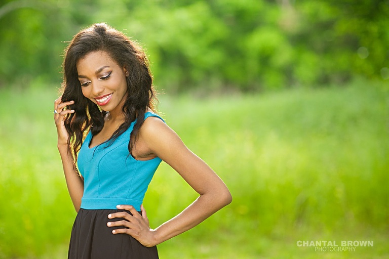 Wylie East high school senior student picture smiling just like a Cover Girl model  during golden sunset hour taken by Dallas senior portrait photographer of Chantal Brown Photography.