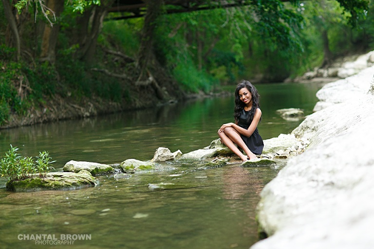 Lovely senior picture setting on a white rock at a lake taken by Frisco senior photographer of Chantal Brown Photography.