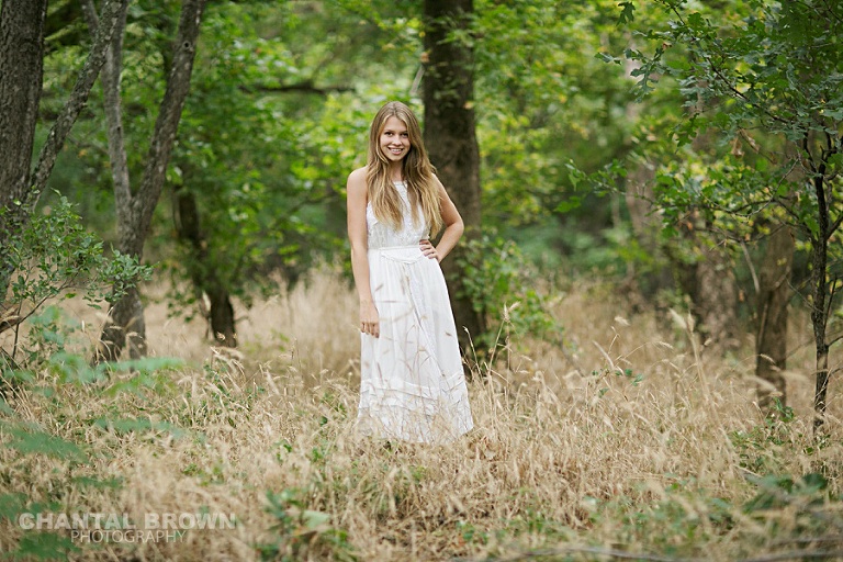 Plano Greenhill senior portraits in tall long grass field taken by Dallas senior photographer Chantal Brown Photography.