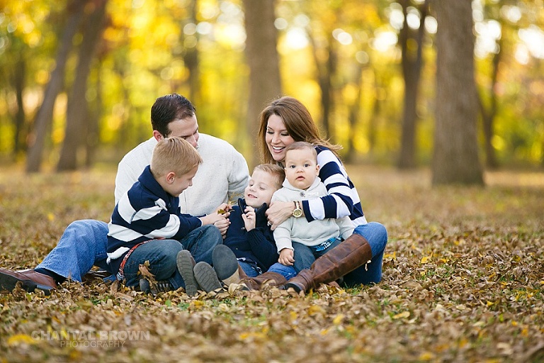 The greatest kids and parents family portrait taken in Dallas in the fall with gorgeous yellow leaves laughing by Chantal Brown Photography