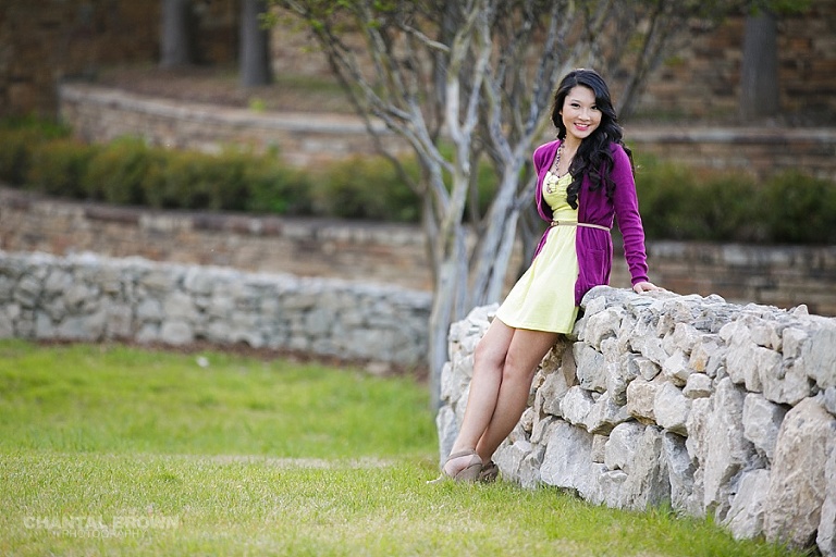 Beautiful senior portraits leaning on white architecture stone wall taken at Adriatica Village by Chantal Brown of McKinney senior portrait photographer.