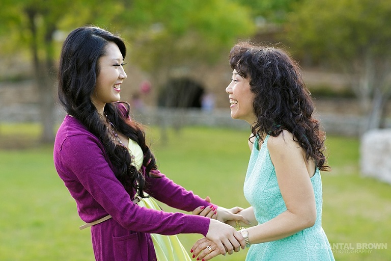 Gorgeous mother and daughter family picture laughing together at Adriatica Village in McKinney TX.