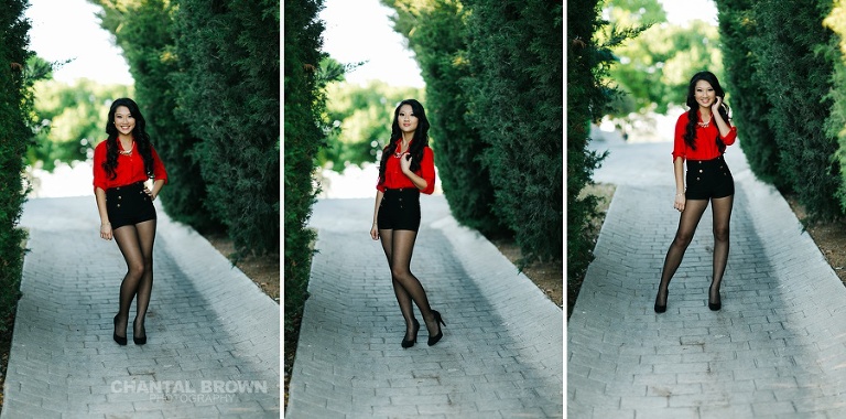 Stunning sunset senior portraits McKinney TX standing on cobblestones streets with pine trees in Adriatica Village.