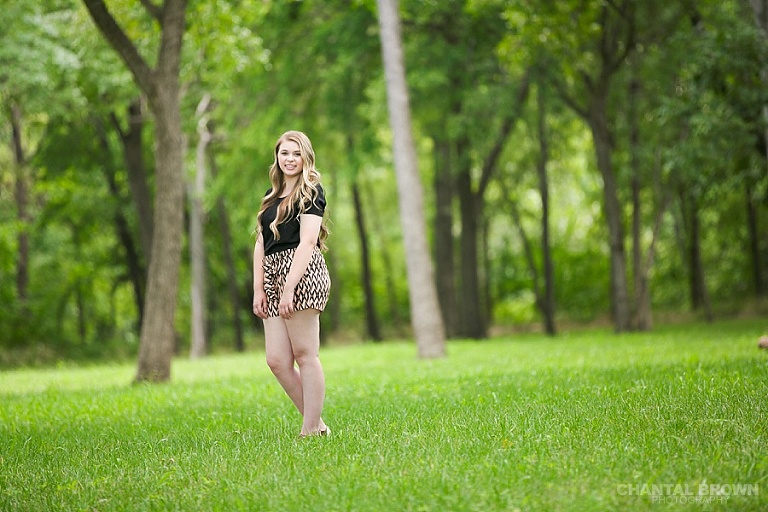 Gorgeous outdoor high school senior pictures taken at Breckinridge Park out in a big field by Dallas senior portrait photographer Chantal Brown.