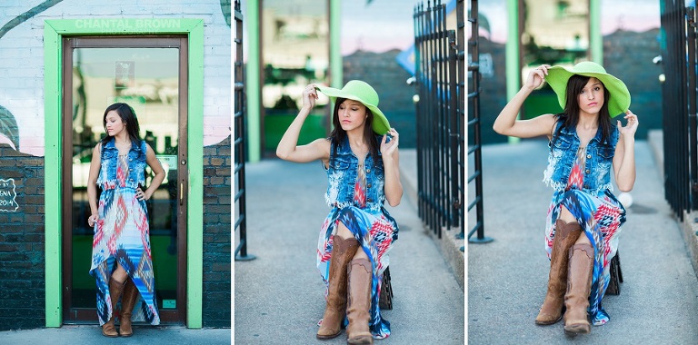 Deep Ellum senior picture leaning on black metal fence and flower wall at Cafe Brazil in Dallas.