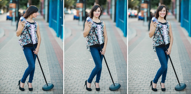 Senior Portraits in Deep Ellum in Dallas TX by blue wall holding the 50s styled microphone.