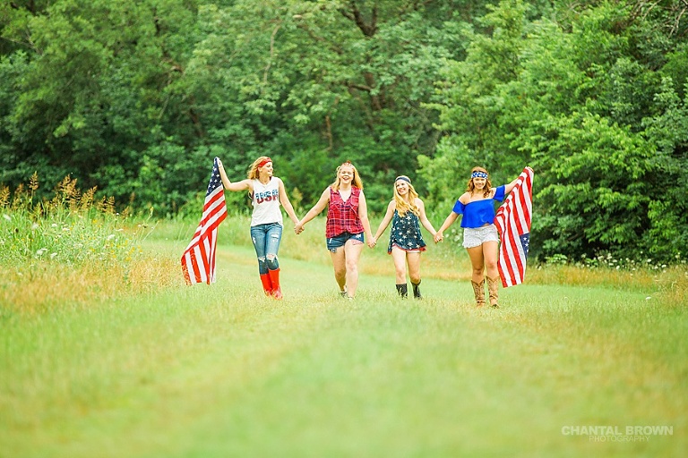 Happy July 4th in Dallas styled senior portraits group photo shoot holding American flags.