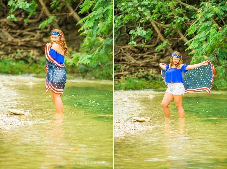 Standing in the water of Mesquite high school student wrapped around an American flag scarf themed photo shoot outdoor session in the water. This picture is taken by Dallas Chantal Brown Photography.